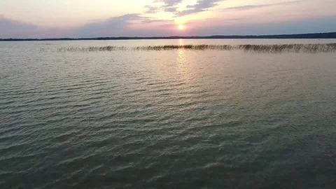 Flight over the lake sundown Stock Footage 99119027