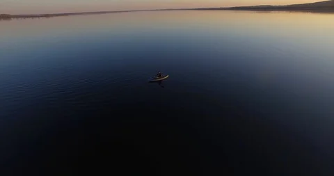 Flight over the lake at sunset Stock Footage 96444996