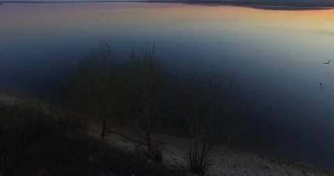 Flight over the lake at sunset Stock-Footage 96445915