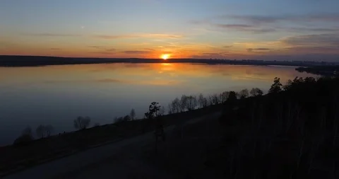 Flight over the lake at sunset Stock Footage 96445959