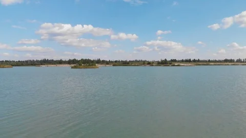 Flight over the lake towards the forest 動画素材 97097181