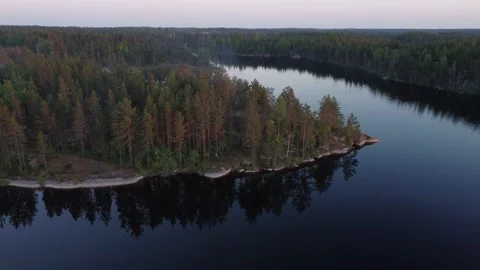 Flight over lakes and forests in Karelia in Russiaat sunset. Stock-Footage 156537401