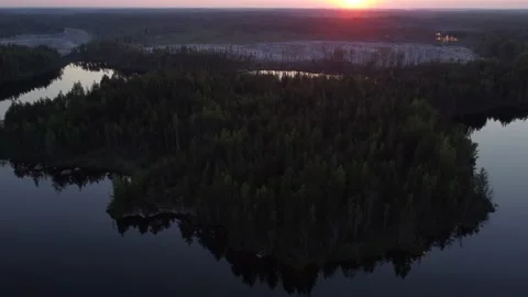 Flight over lakes and forests in Karelia in Russiaat sunset. Stock-Footage 156537480