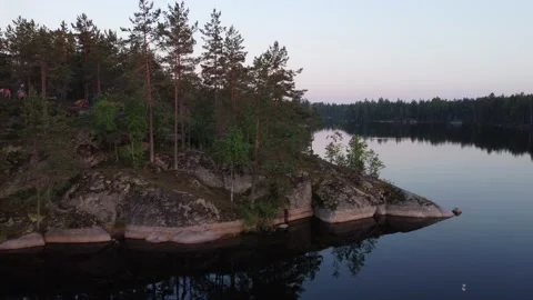 Flight over lakes and forests in Karelia in Russiaat sunset. Stock-Footage 156537625