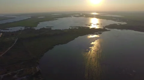 Flight over the lakes at sunset Stock Footage