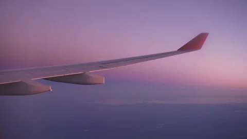 Flight over the land at sunset. the view from the plane Stock Footage 97794556