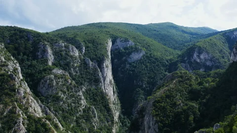 Flight over a large canyon in the middle of the mountains Stock Footage 136224245