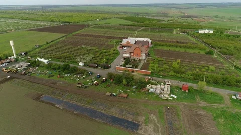 A flight over a large farm house. Among vineyards, fields and gardens. Russian f Stock Footage 125338599