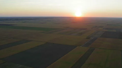 Flight over a large with a wind turbine and a sunset panorama Stockbeeldmateriaal 138258785