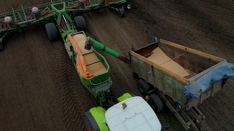 Flight Over Loading Trucks Full of Seeds, Preparing to Sow, Modern Farm. Video stock 127985508