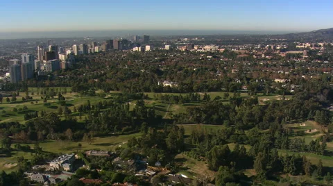 Flight over Los Angeles golf course toward skyscrapers. Shot in 2008. Stock Footage 59512866
