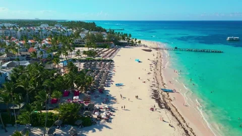 Flight over Los Corales beach on a bright sunny day in Bavaro Punta Cana Stock Footage 307562262
