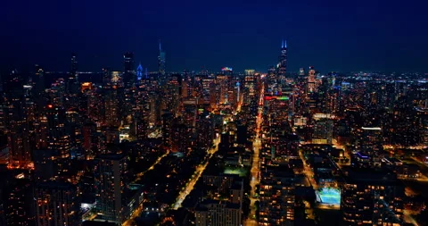 Flight over the luminous panorama of Chicago, Illinois, USA at night. Vibrant Stock Footage 340927268