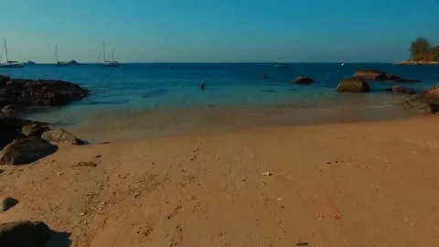 Flight over man preparing to snorkeling on the beach. Stock Footage 69187743