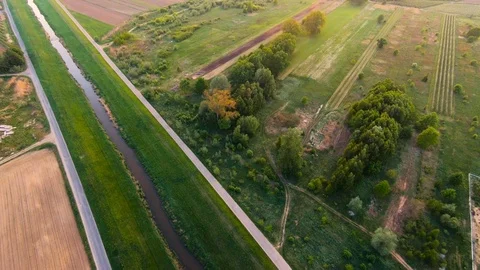 Flight over the meadows and trees and river Stock Footage 89455338