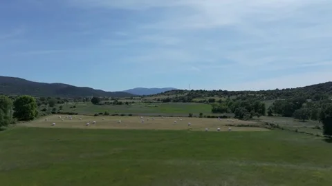 Flight over meadows with large bundles of grass 스톡 동영상 277214901