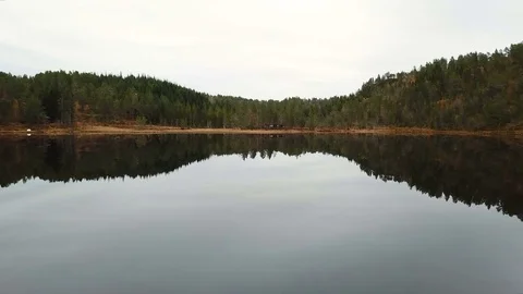 A flight over a mirror lake Stock Footage 83009902