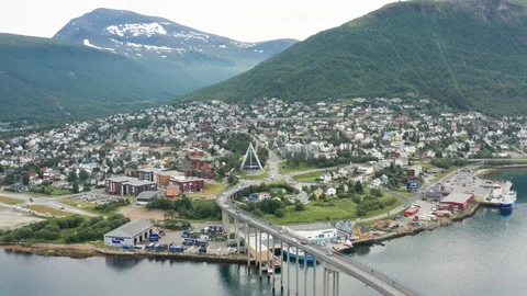 Flight over modern Arctic Cathedral in Tromso Stock Footage 129446781