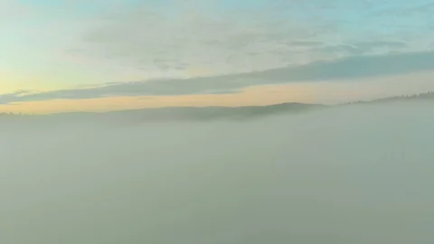 Flight over morning mist in a river valley Stock Footage 115911580