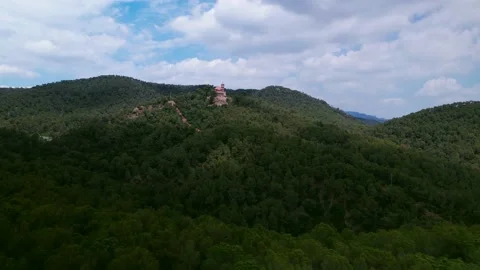 Flight over the mountain forest towards the ancient castle. Видео 156509622
