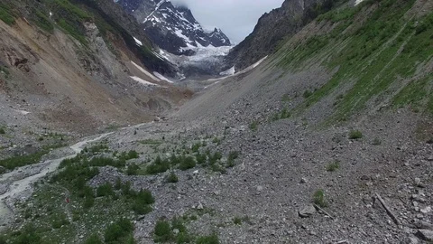 Flight over mountain gorge in front of the glacier Video stock 77200509