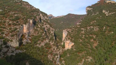 Flight over a mountain gorge. High cliffs against the blue sky, drone view Stock Footage 287008579