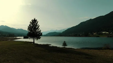 Flight over mountain lake sunset. Stock Footage 107399645