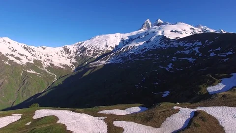 Flight over mountain plateau towards the Ushba Peak Video stock 79926351