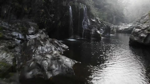 Flight over the mountain river between rocks and vegetation Stock Footage 118771894