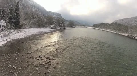 Flight over a mountain river in winter Bavaria, Germany Stock Footage 20524779