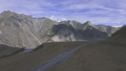 Flight over a mountain road Stock Footage 162056048