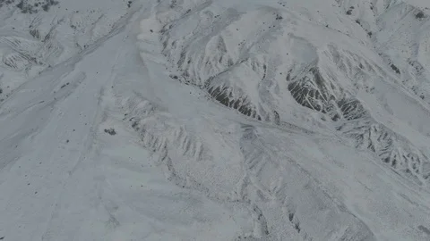 Flight over the mountain slopes in winter Stock Footage 105682857