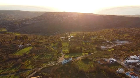 Flight over the mountain village of Cyprus, small houses among green hills Stock Footage 124650192