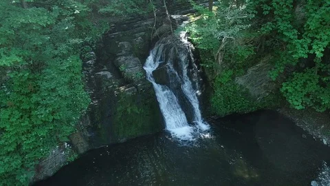 Flight over a mountain waterfall. Video stock 90494867