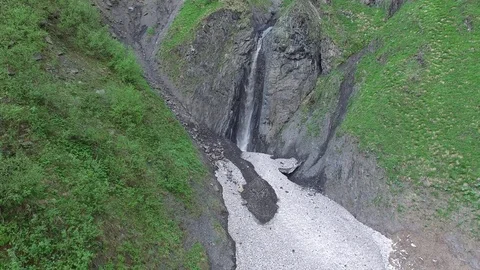 Flight over mountain waterfall in the form of heart 스톡 동영상 77180653