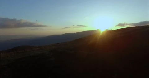 Flight over the mountains against the sun Stock Footage 131225855