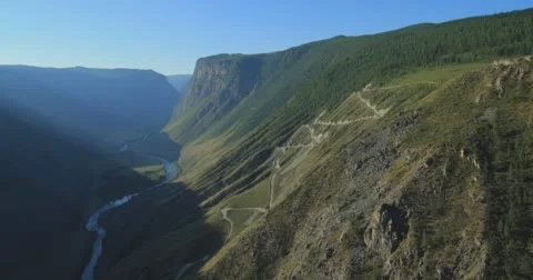 Flight over the Mountains. Altai. Siberia. Flying over the River. Forest Valley. Stock Footage 63427088