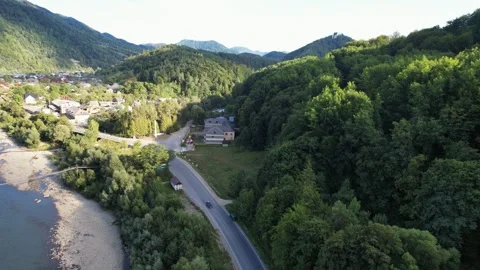 Flight over mountains forest and river in sunny summer day Stock Footage 262275622