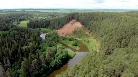 Flight over the mountains, forests and the river Video stock 113319732