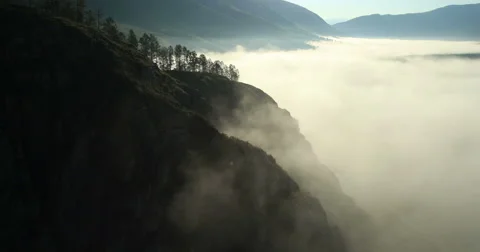 Flight over the Mountains in the thick clouds. Morning Fog. 4K resolution. Stock Footage 41131336