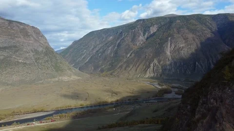 Flight over the mountains. Top view hills and river Stock Footage 142418729