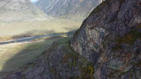 Flight over the mountains. Top view hills and river Stock Footage 142419111