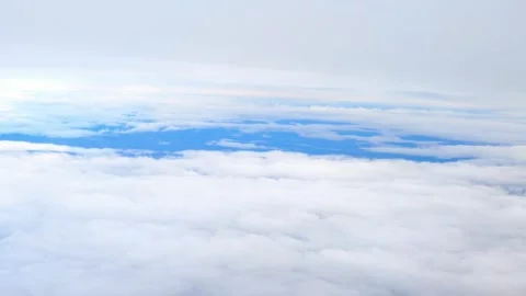 Flight over moving clouds, aerial view, daytime - 4K Stock Footage 255576598