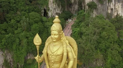 Flight over Murugan statue, Batu Caves Stock Footage 61038086