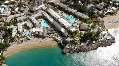 Flight over the ocean coast and hotels and people on vacation Video stock 101487450