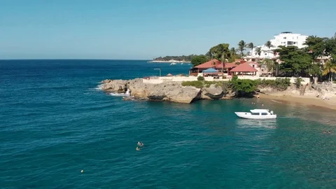 Flight over the ocean coast rifs and hotels Stock Footage 101486791