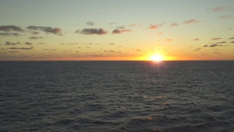 Flight over of ocean during sunset. Aerial of open sea Video stock 76548322