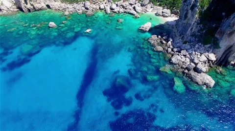 Flight over ocean sea water Greece Corfu cliff rocky coast harbor bay 4k video Stock Footage 66570463
