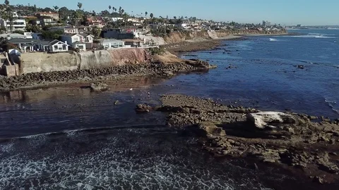 Flight over ocean showing oceanfront property of La Jolla in San Diego Stock Footage 84757863