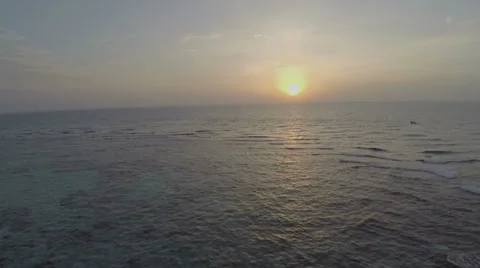 Flight over ocean at sunset Stock Footage 39652740